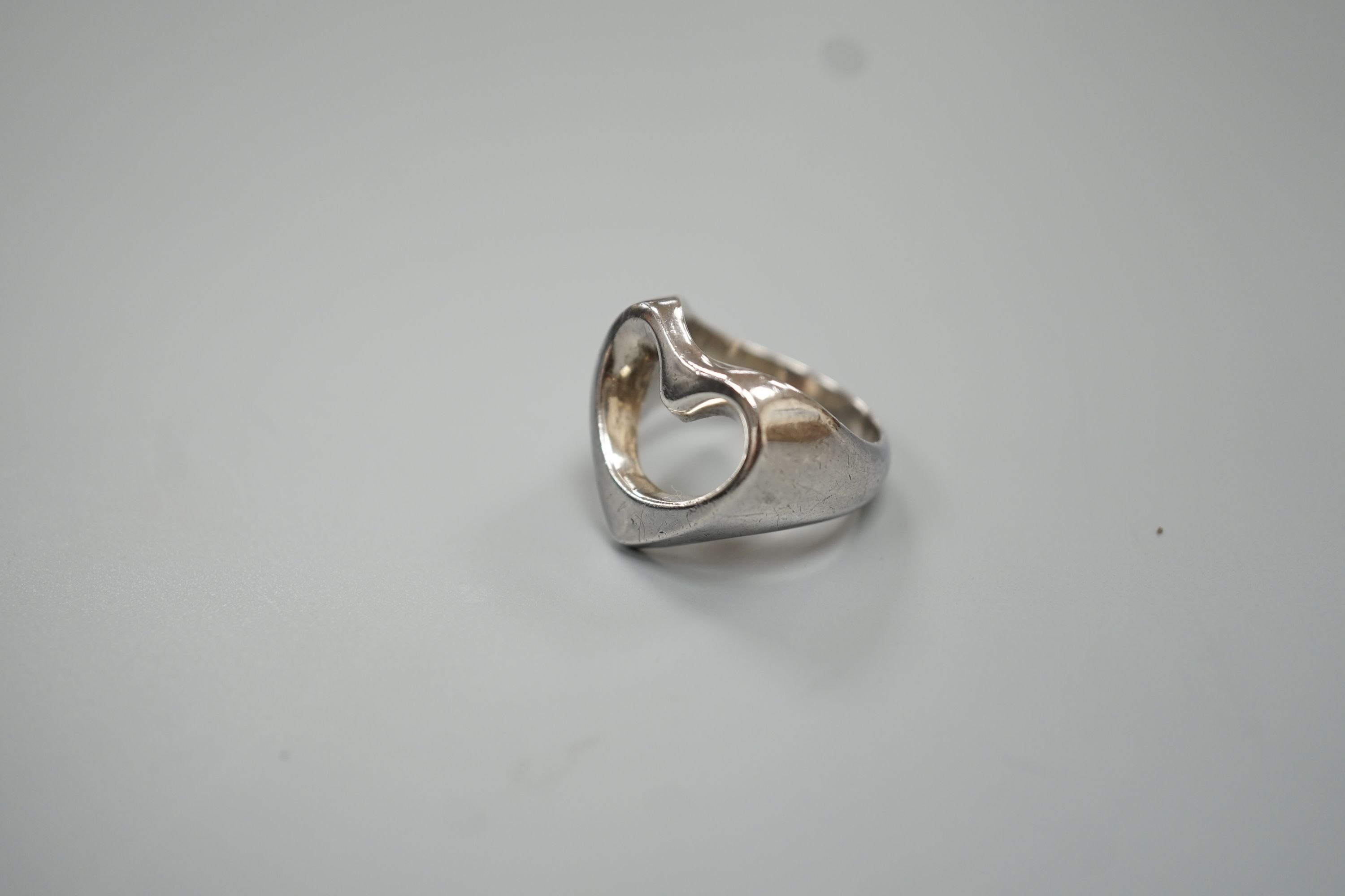 A Georg Jensen sterling pierced heart shaped ring, size M/N, 9.9 grams.